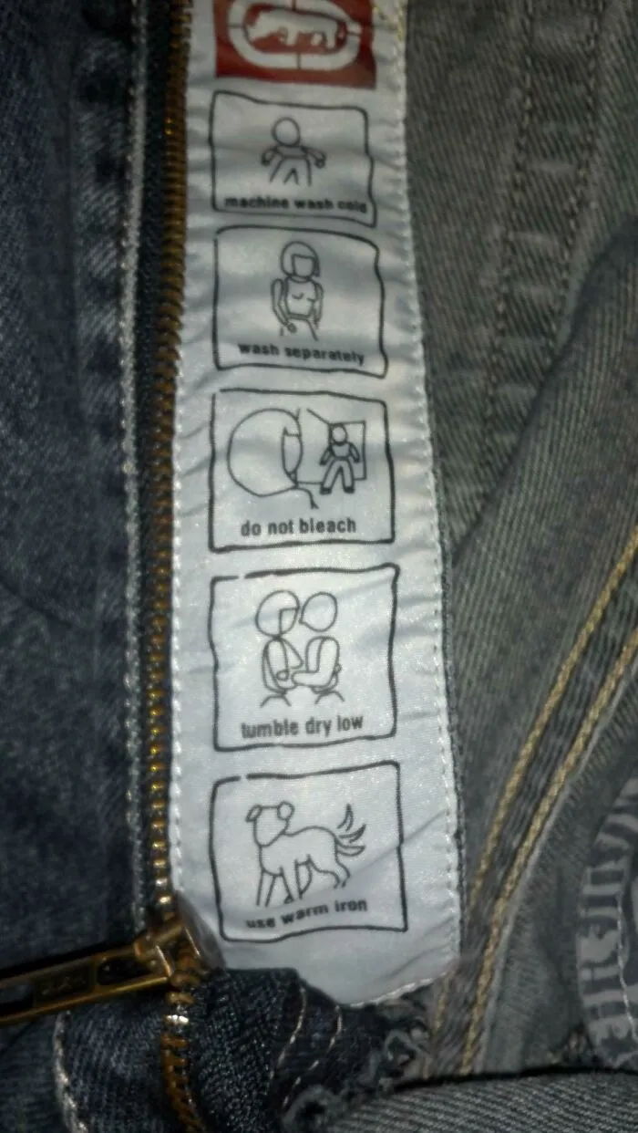 Clothing tag with confusing labels and instructions illustrated by strange icons.