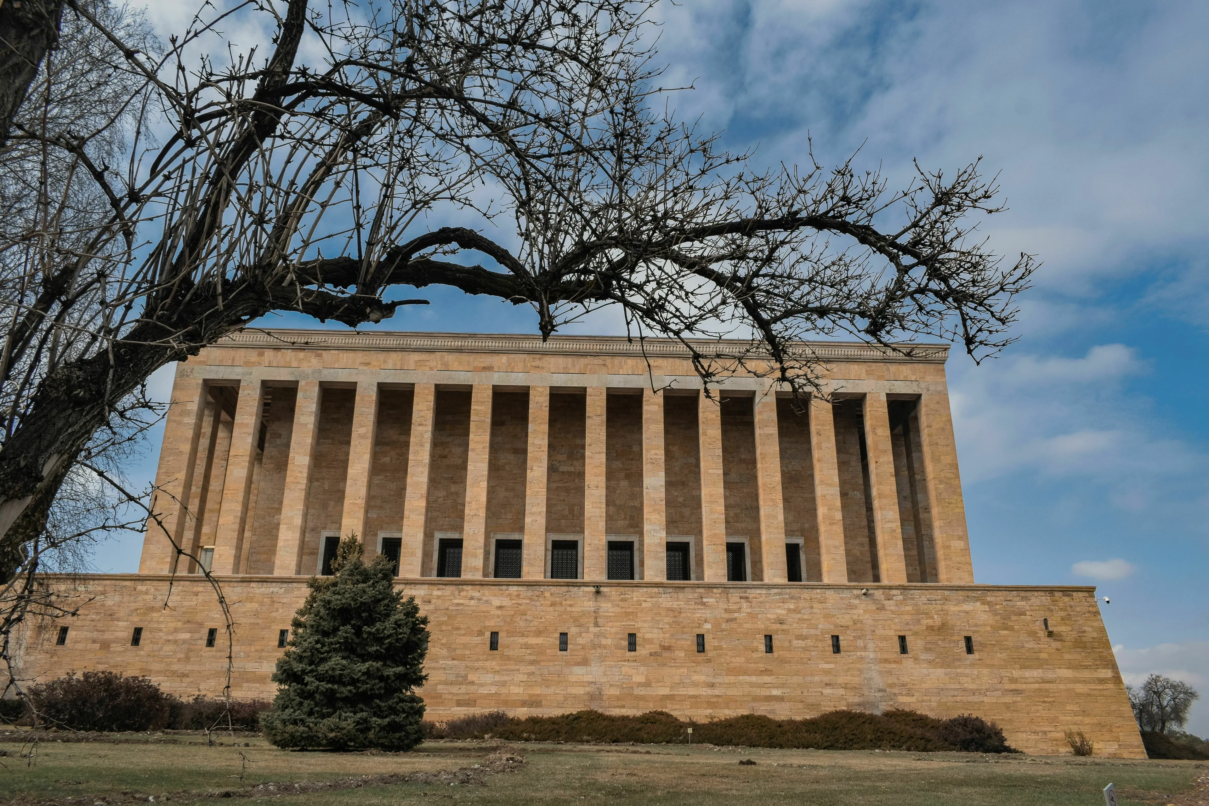 Anıtkabir mausoleum in Ankara with columned facade and tree in foreground