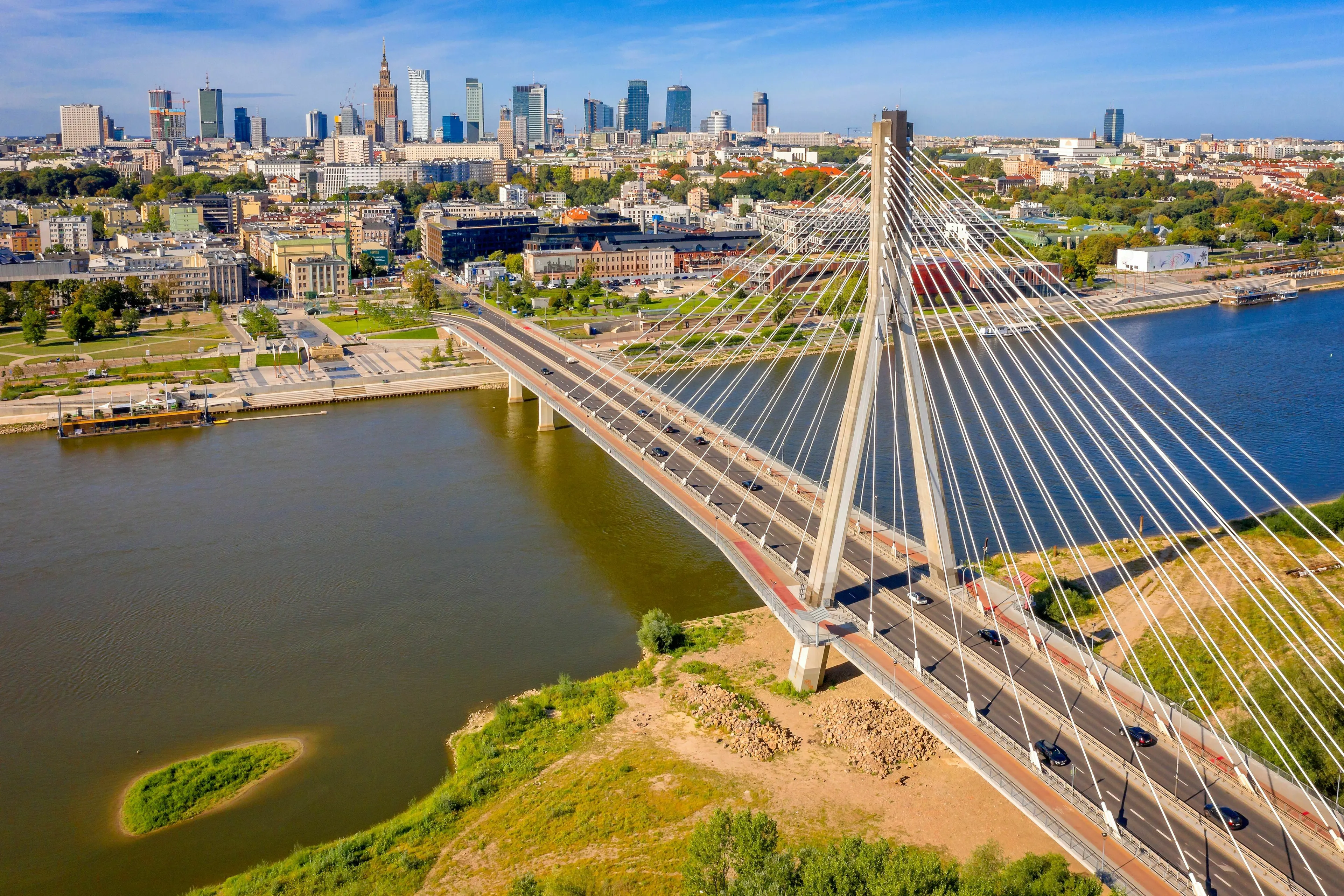 Warsaw city skyline with bridge over Vistula River in Poland capital