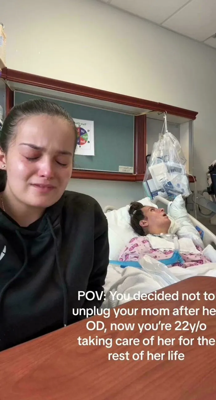 An influencer filming content in a hospital room beside a patient for social media.