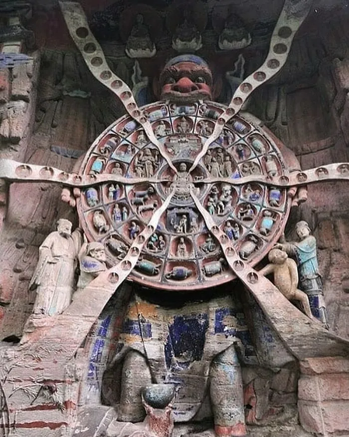 Intricate stone carving of the Buddhist wheel of life revealing cool history facts about the past.