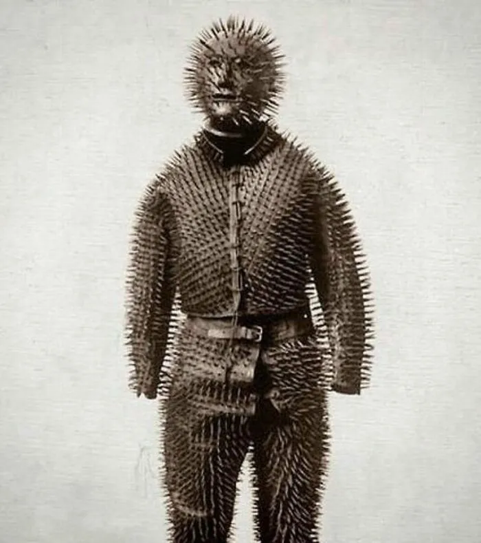 A weird history suit made entirely of sharp iron spikes used for bear hunting.