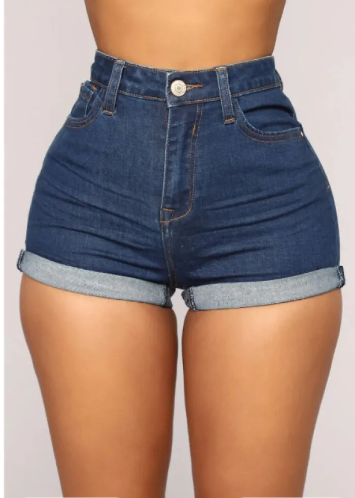 High-waisted denim shorts worn on a model, showcasing clothing tight around female anatomy.