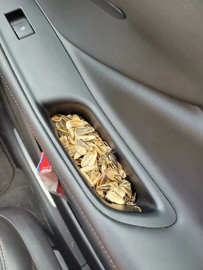 Car door handle filled with sunflower seed shells revealing what partners do that drives people insane