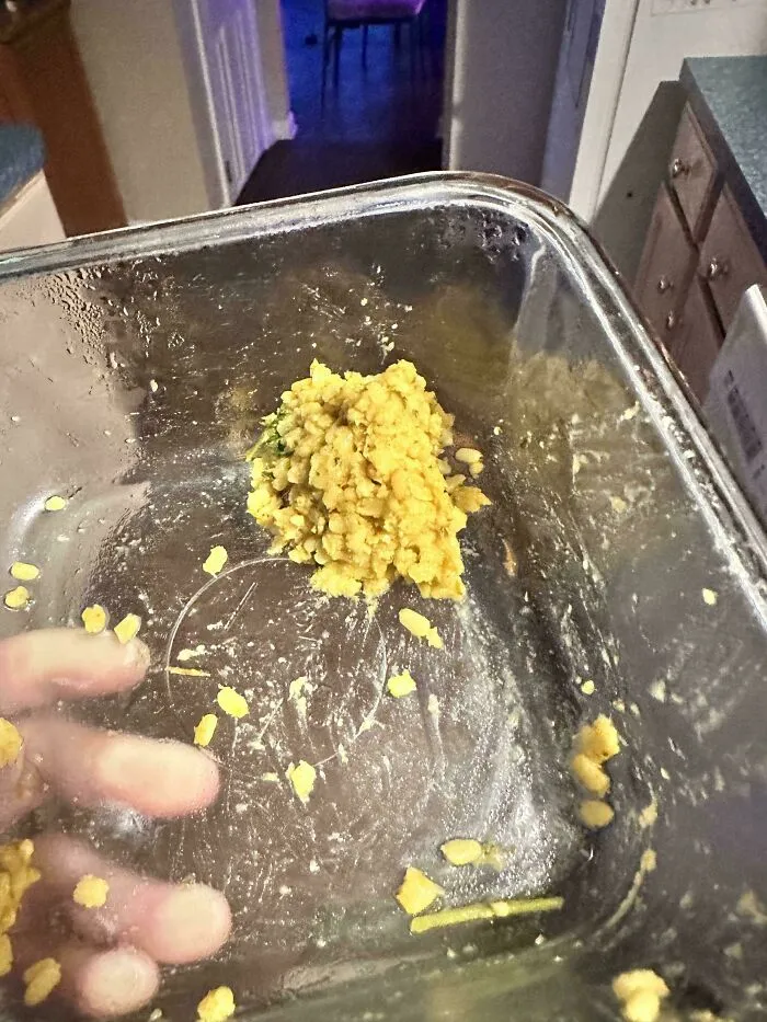 A glass food container containing a single bite of leftover food that drive people insane.