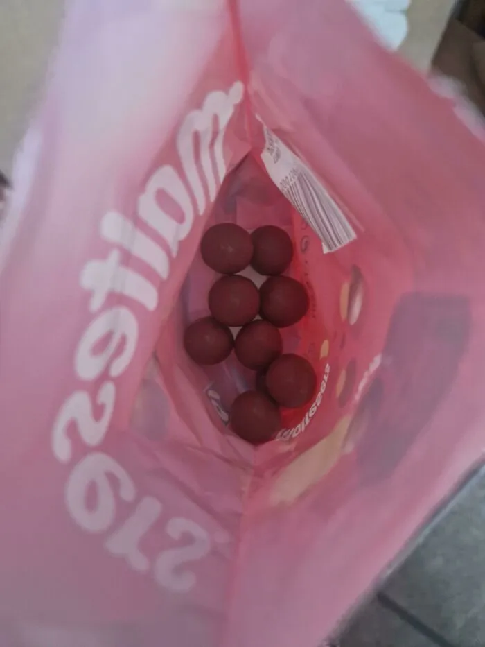 A nearly empty bag of Maltesers candies, highlighting things partners do that drive people insane.
