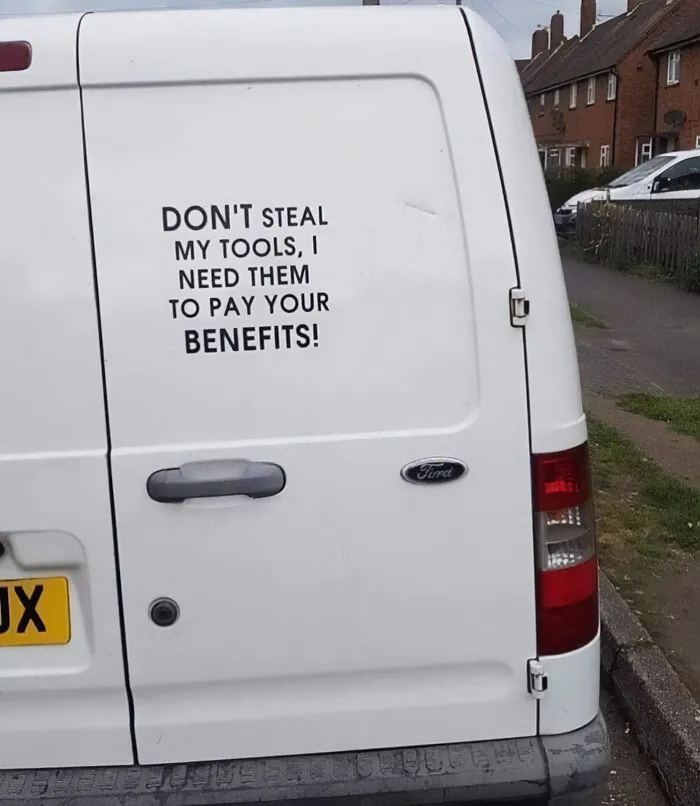 White work van with a funny quote about tools, showcasing funny cringe construction fails memes.