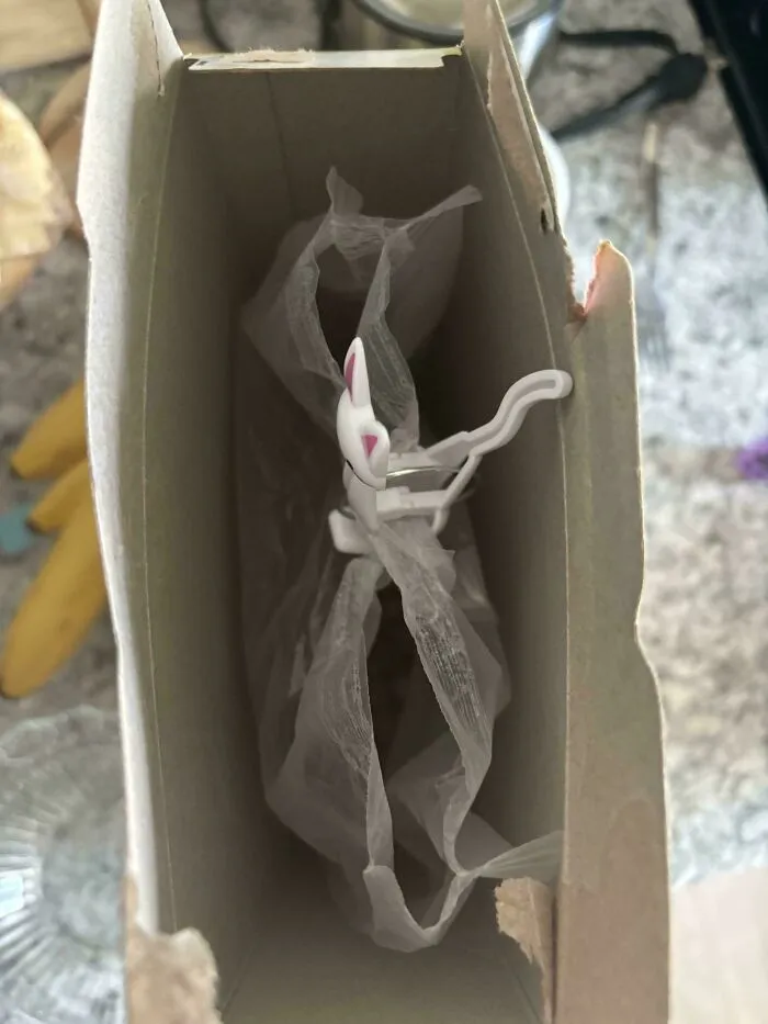 A clip attached to an open cereal bag inside the box, showing things partners do.