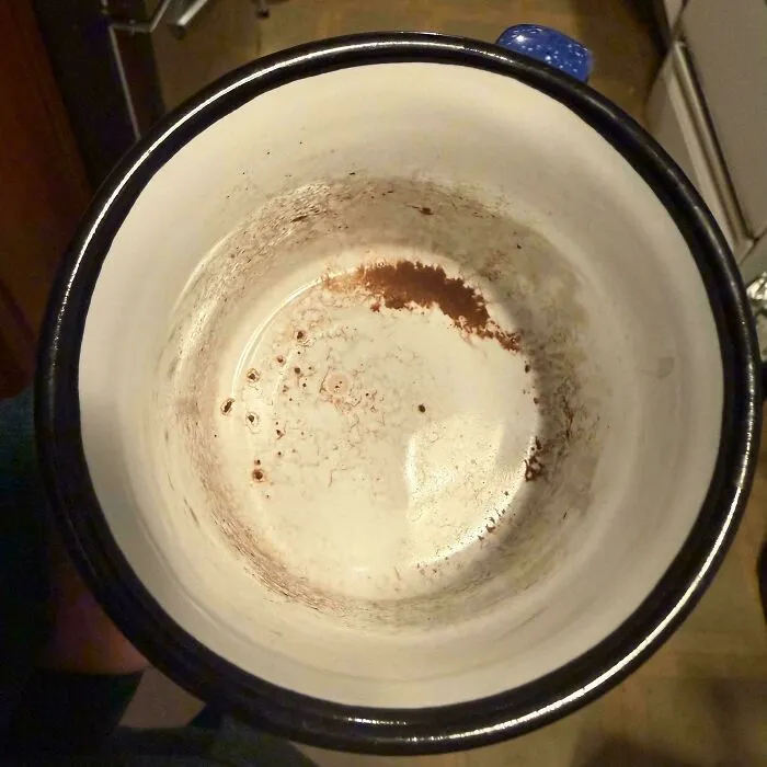 An unwashed pot with residue left inside, showing things partners do that drive people insane.