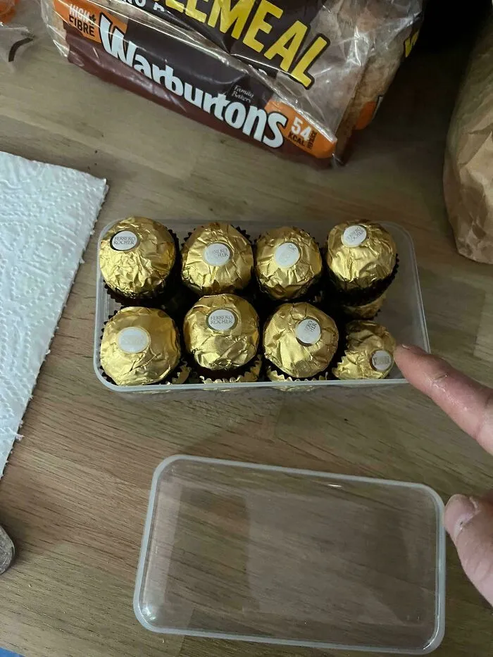 Hand pointing at a box of chocolates showing things partners do that drive people insane.