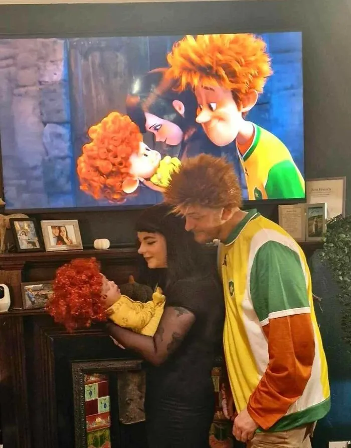 A family recreating an animated movie scene using themed Halloween costumes.
