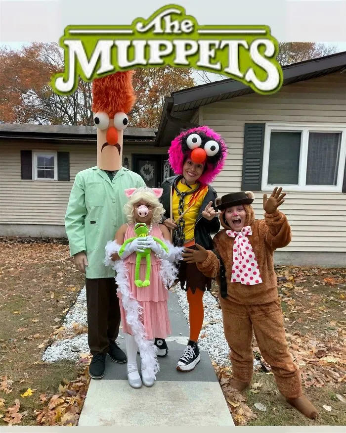 A family posing outdoors together in creative Muppets themed Halloween costumes.