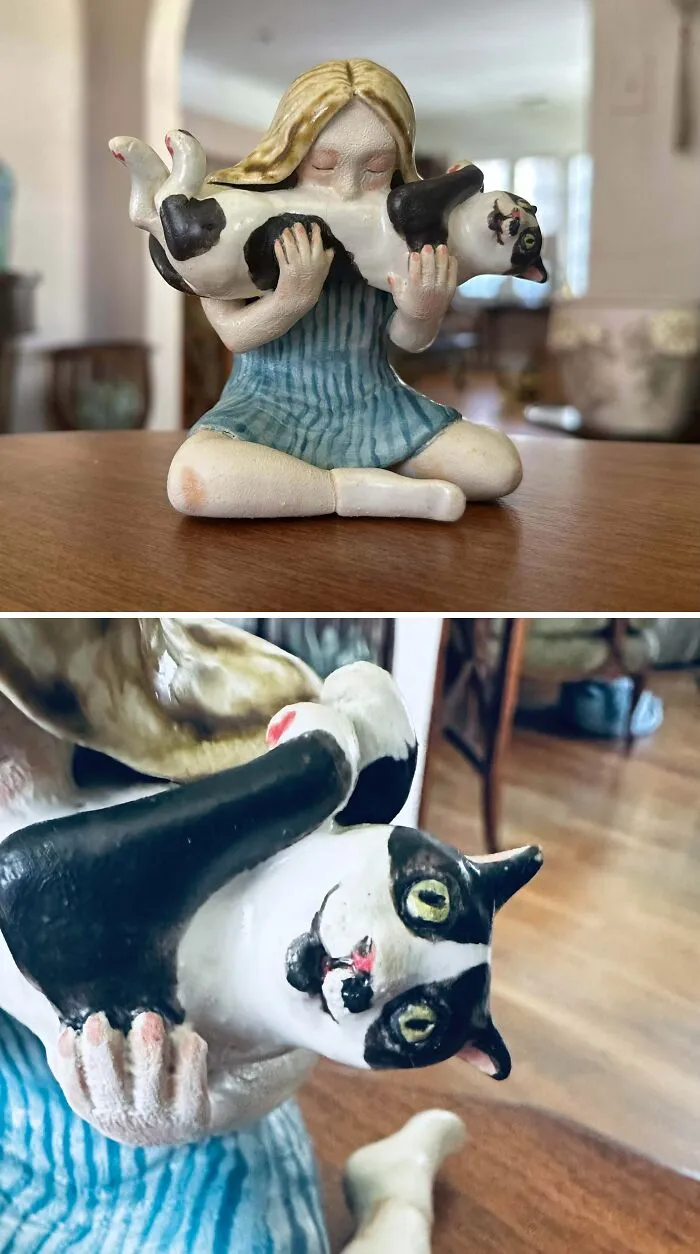 A detailed ceramic figurine of a girl holding a cat, showcasing artistic pottery creations.