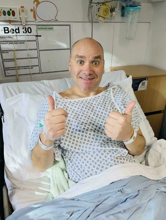 A happy patient giving thumbs up in a hospital bed, one of the most wholesome moments on the internet.
