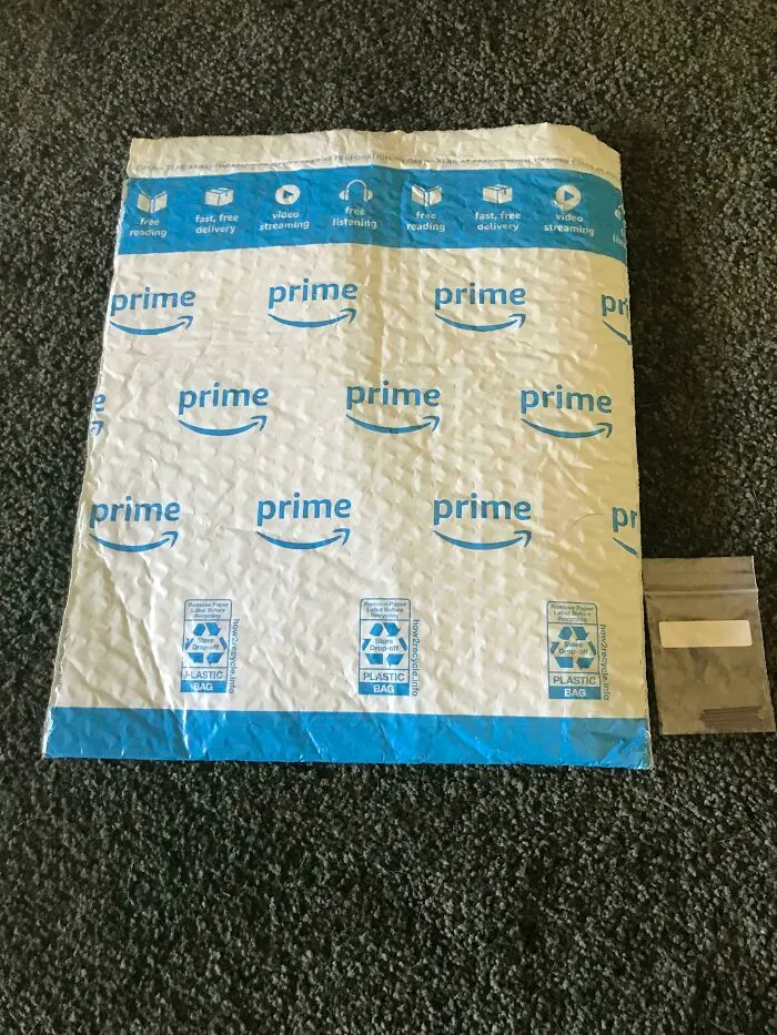 Huge padded envelope next to tiny tiny zip bag inside showing packaging fails.