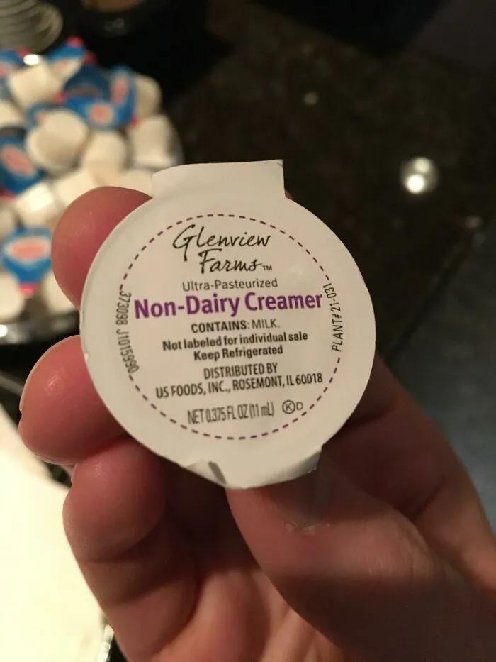 A single-serve creamer pod showing bad packaging fails labelled non-dairy but contains milk.