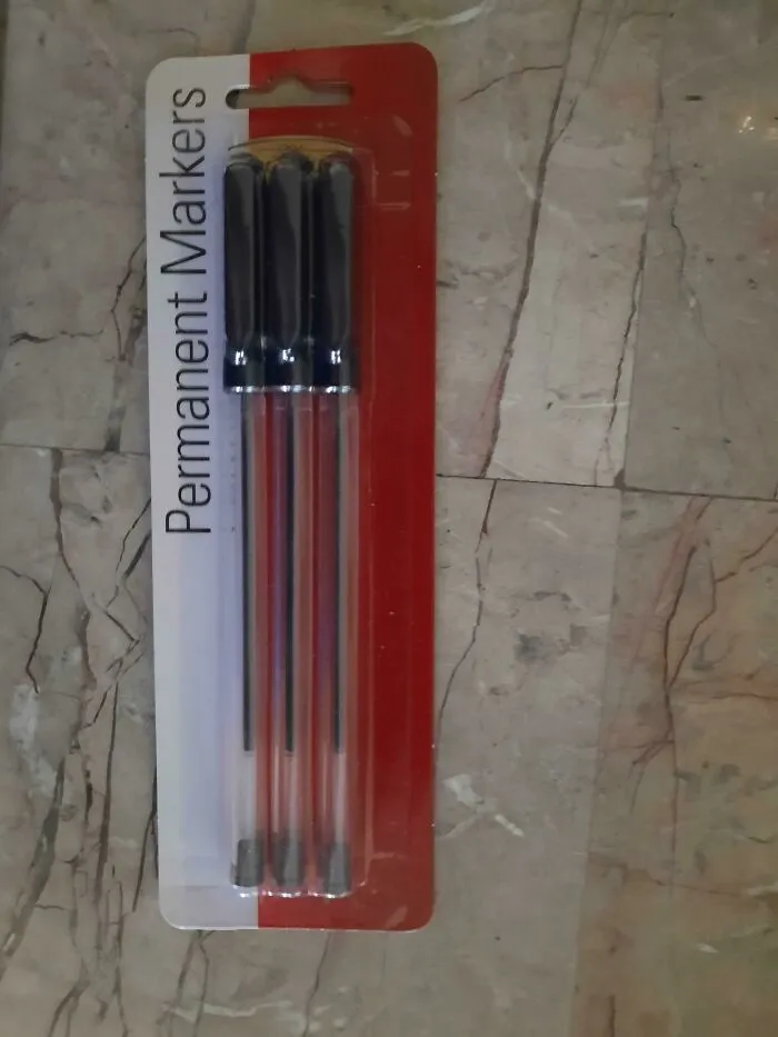 A package labeled Permanent Markers that contains clear ink pen refills instead, illustrating packaging fails.