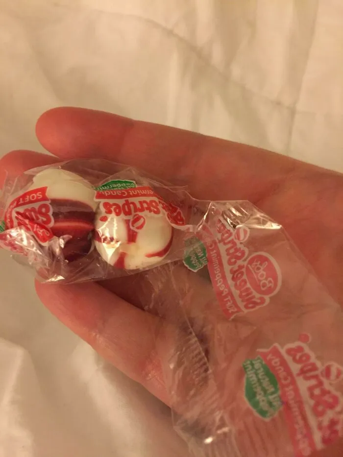 Single hard candy individually wrapped inside a comically large plastic wrapper, showing bad packaging fails.