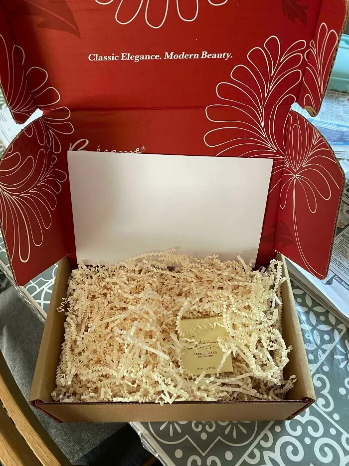 An oversized delivery box filled with paper packing as a bad packaging fail for a tiny item.