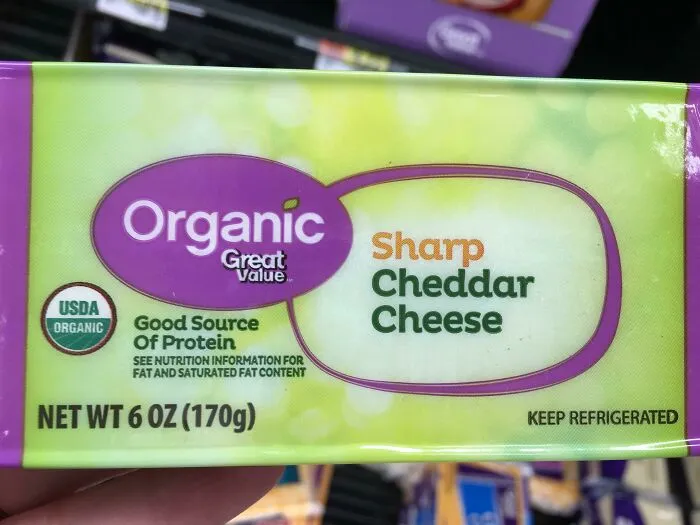 Great Value Sharp Cheddar Cheese label showing a funny packaging design fail with misleading product descriptions.