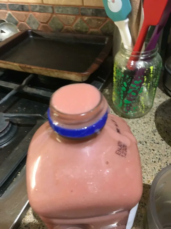 A juice container filled to the very top edge, an example of packaging fails.