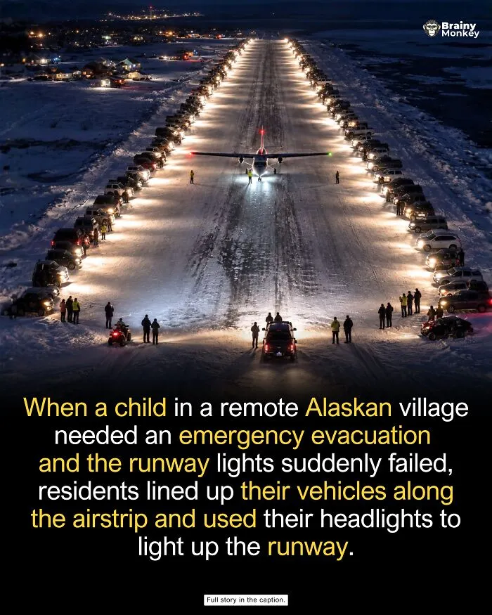 Cars lining a snowy runway with headlights illuminating a plane for wholesome facts