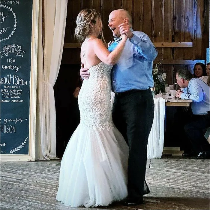 A bride laughing while dancing with her father, captured in photos for the last time before his passing