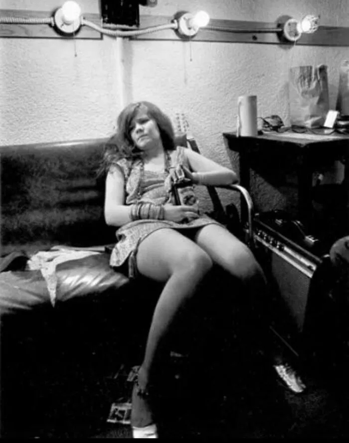 Musician holding a bottle backstage captured in photos for the last time