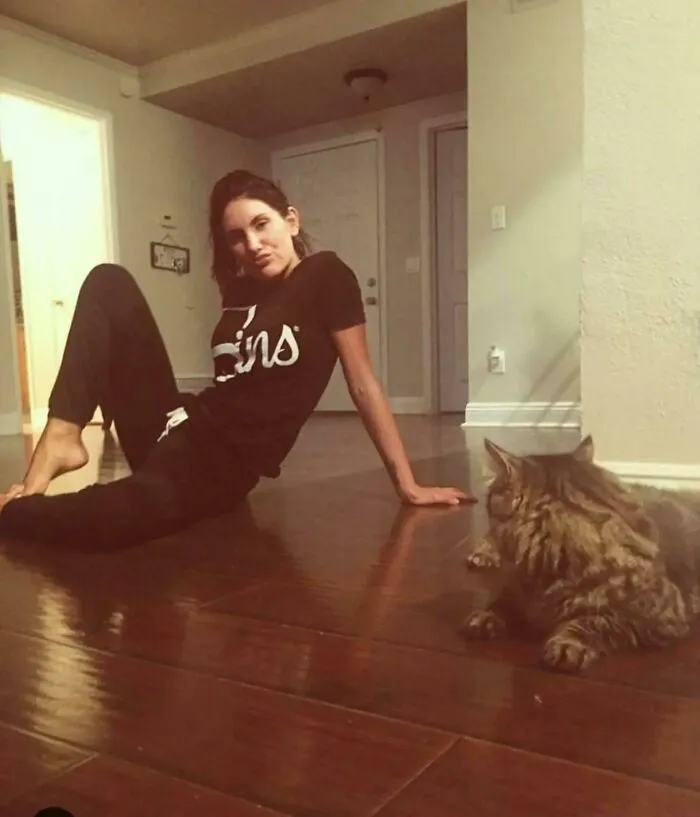 Woman relaxing on the floor with her cat captured in photos for the last time