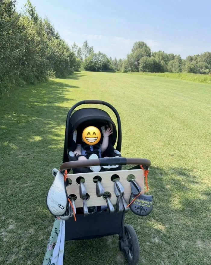 A baby in a stroller attached with golf clubs, highlighting wholesome pics of dads finding creative solutions.