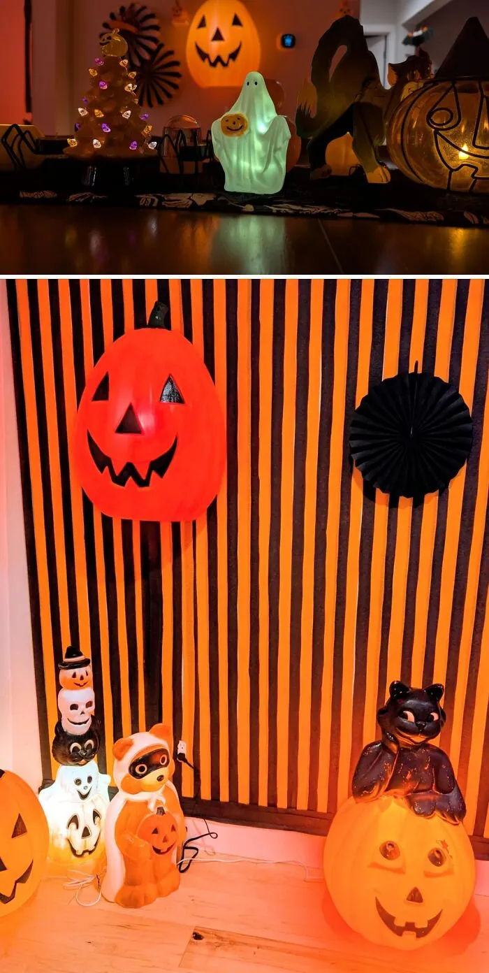 Cozy home interior decorated with glowing Halloween ghosts, pumpkins, and a black cat.