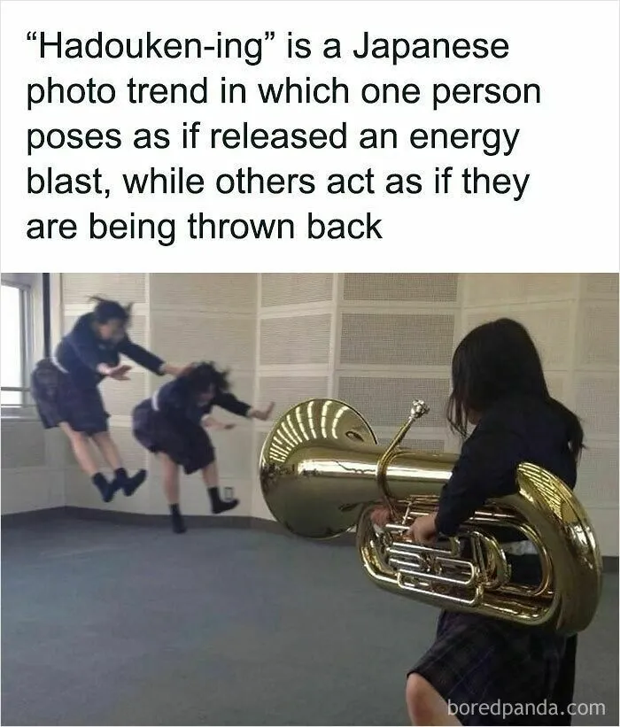 Wholesome memes picture of Japanese students doing a Hadouken-ing photo pose using a tuba.