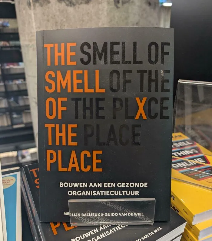 A terribly designed sign on a book cover featuring repetitive confusing text with the words smell and place