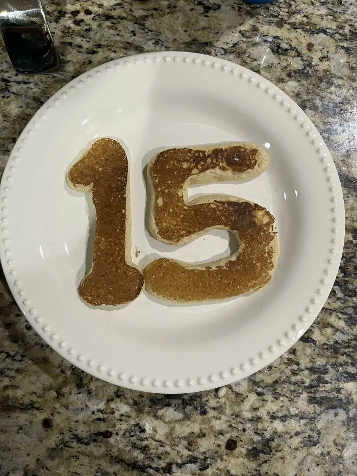 Pancakes shaped like the number 15 on a plate, representing wholesome pics of dads.