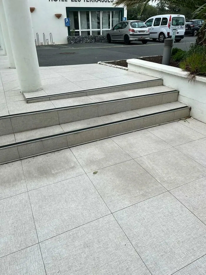 Awkward outdoor steps leading to a building, illustrating bad construction fails.