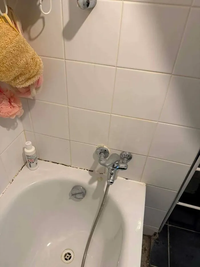 Poorly executed plumbing construction fails featuring a bath faucet installed dangerously low near the tub rim.