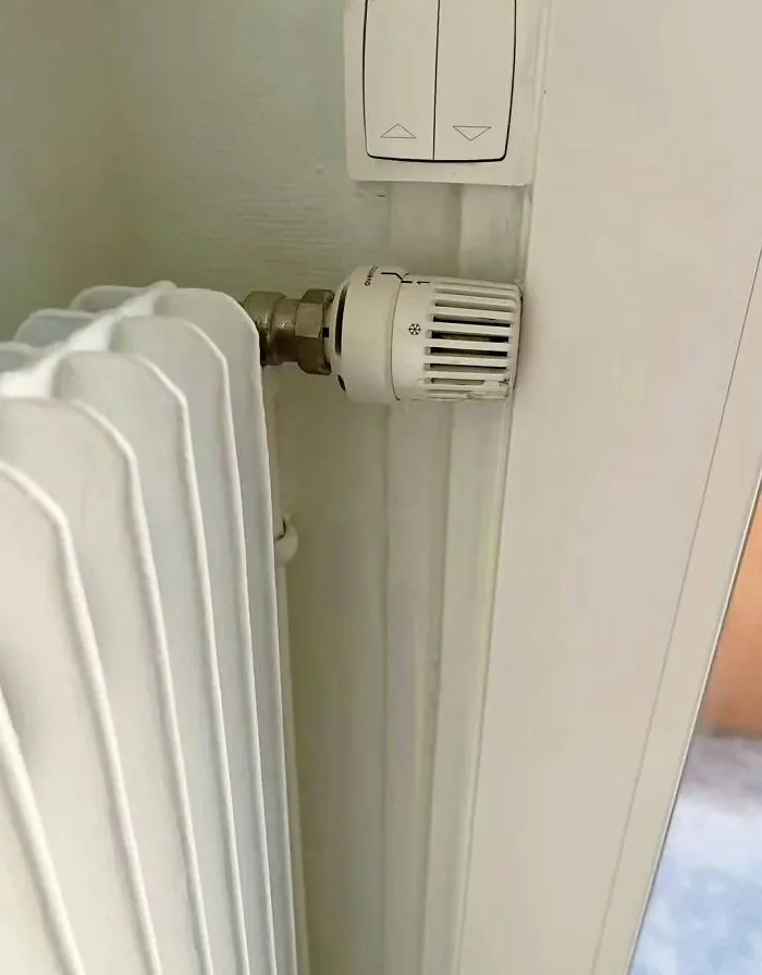 Radiator control knob blocked by wall trim in a construction fails example