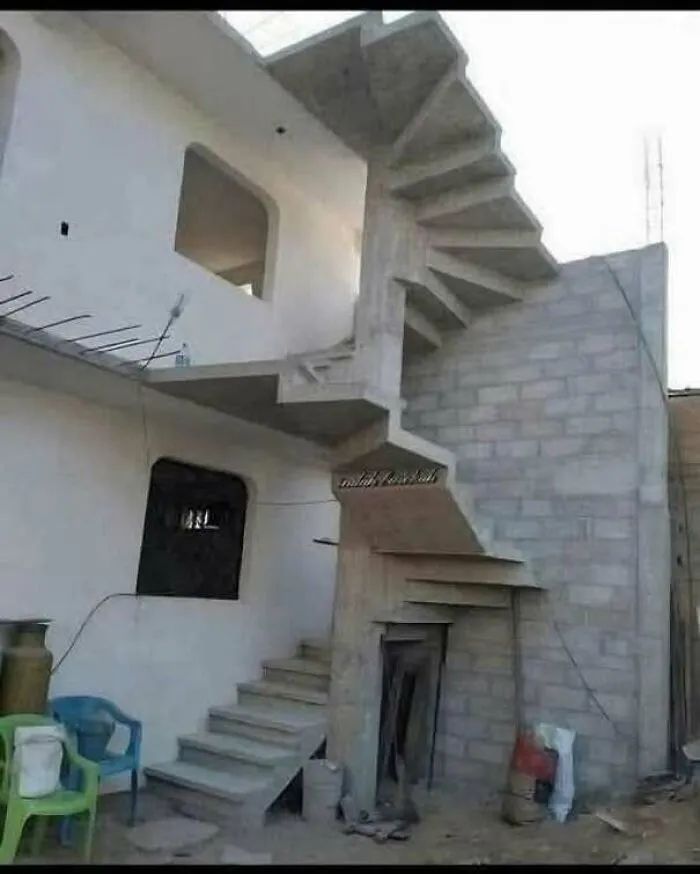 A bizarre spiral staircase built upside down, showing a major construction fail.