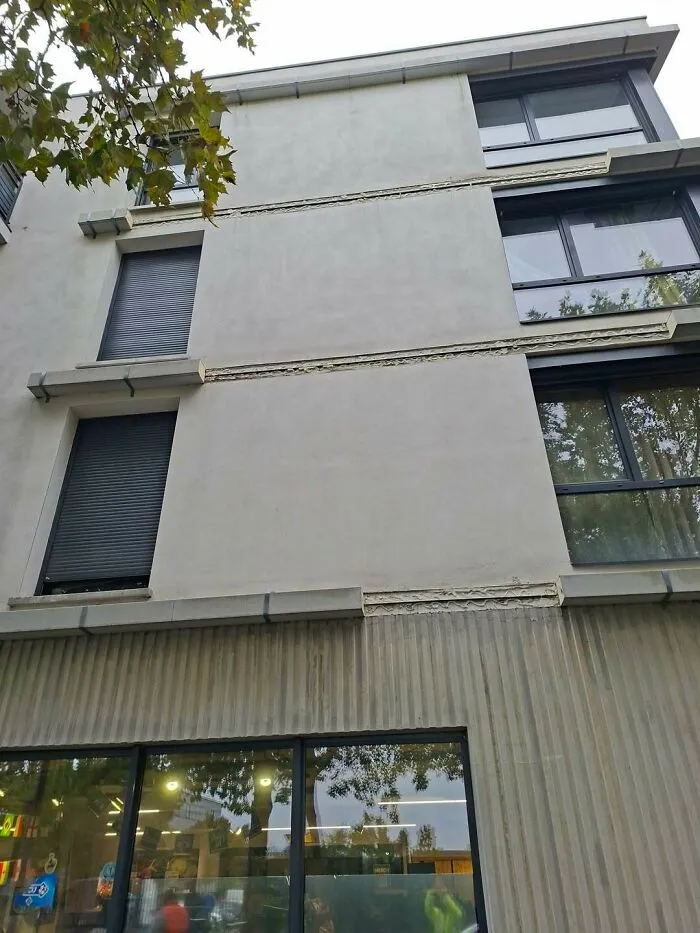 Misaligned windows on a modern building exterior showing a bad construction fail.