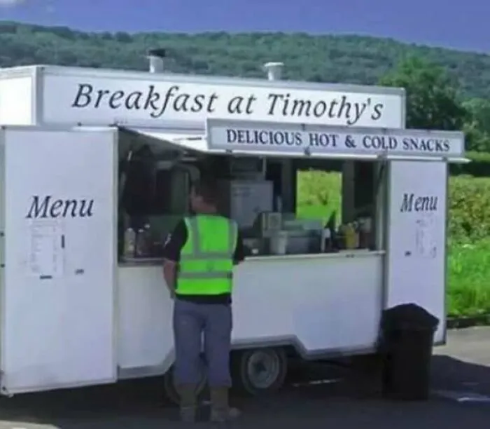 A food truck display showcasing funny ads and signs with humor