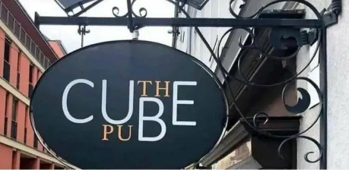 A confusing sign for The Cube Pub that reads like Cut he Pub