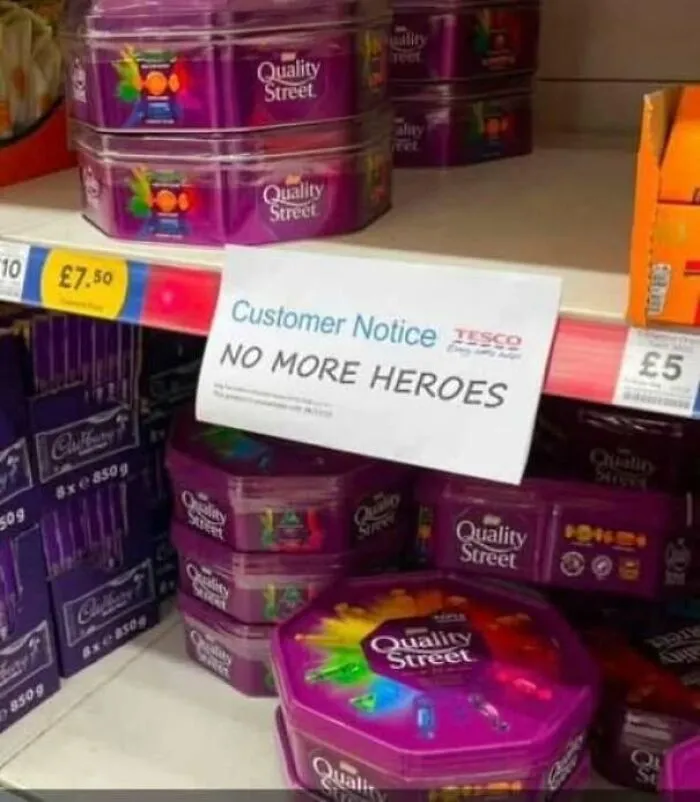 A supermarket shelf with a hilarious sign reading NO MORE HEROES, clearly missing the mark in product placement.