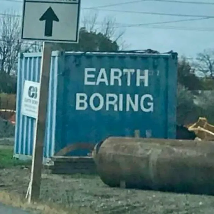 Blue shipping container labelled Earth Boring, serving as one of the hilarious signs that missed the mark.