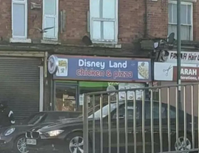 Hilarious shop sign for Disney Land chicken & pizza store.