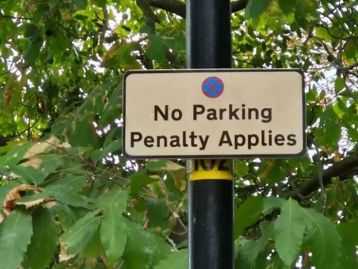 Confusing street sign stating No Parking Penalty Applies, fitting hilarious signs that missed the mark