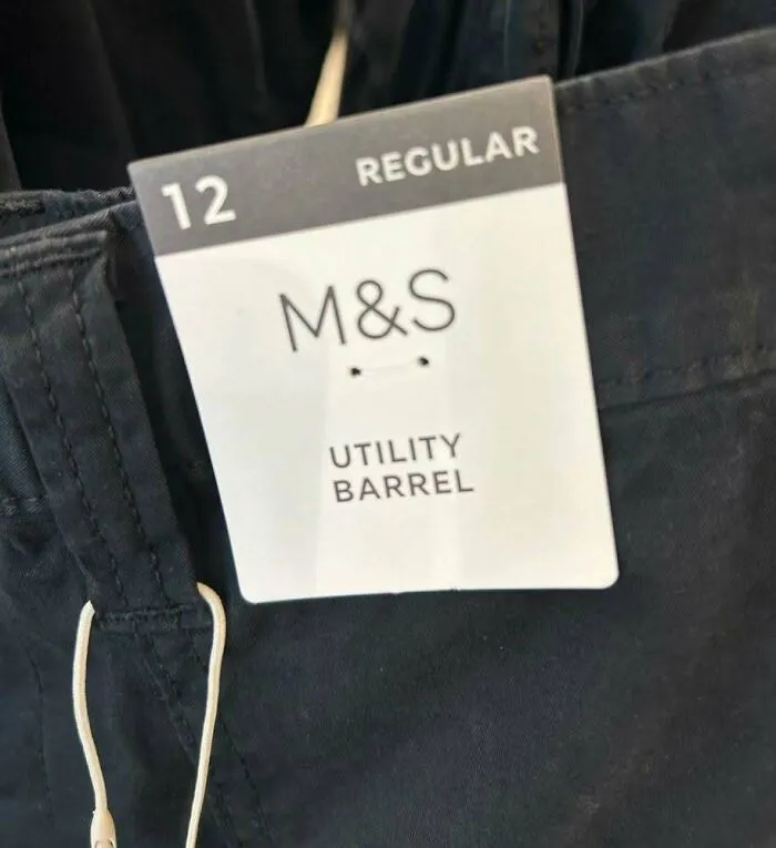 Hilarious ads: a clothing tag for M&S pants with a funny misprint labeling the fit as Utility Barrel.