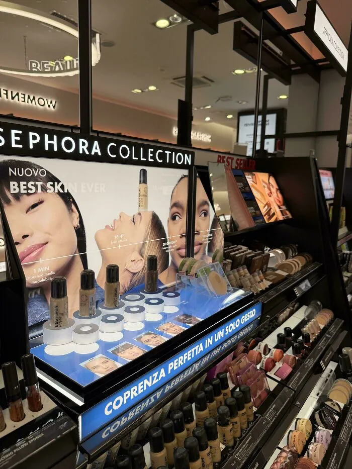 Makeup display with foundation bottles under Sephora Collection sign