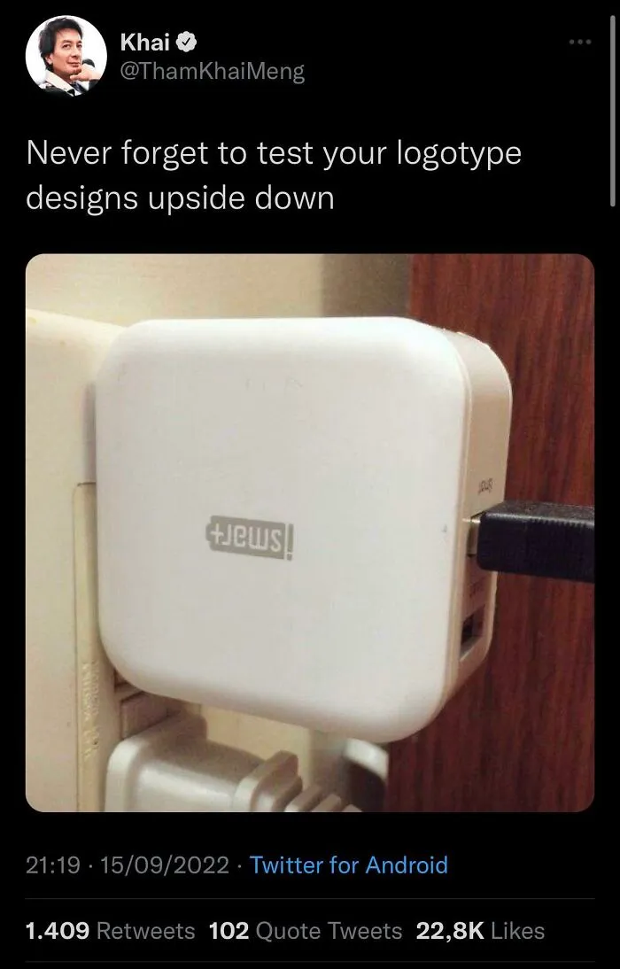 Upside down logo design on a white charger illustrating testing design choice