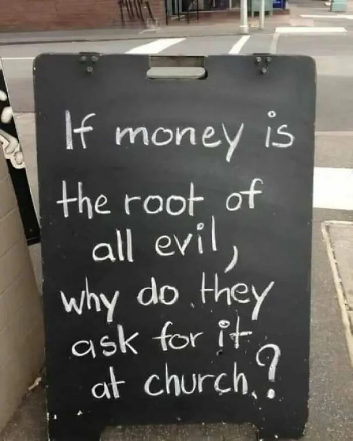 Strange sign on a sidewalk asking a funny question about money and church