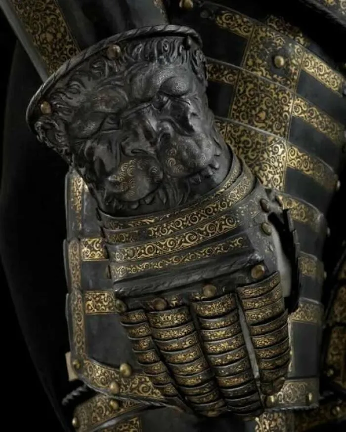 Intricately designed medieval armor gauntlet with lion motif